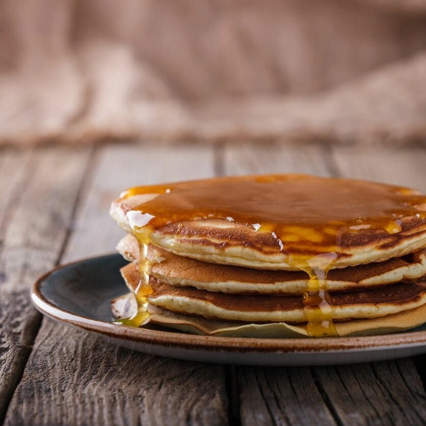 A stack of pancakes on top of a plate.